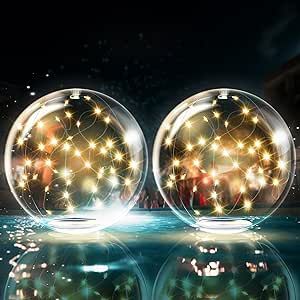 three glass balls with lights reflecting in the water