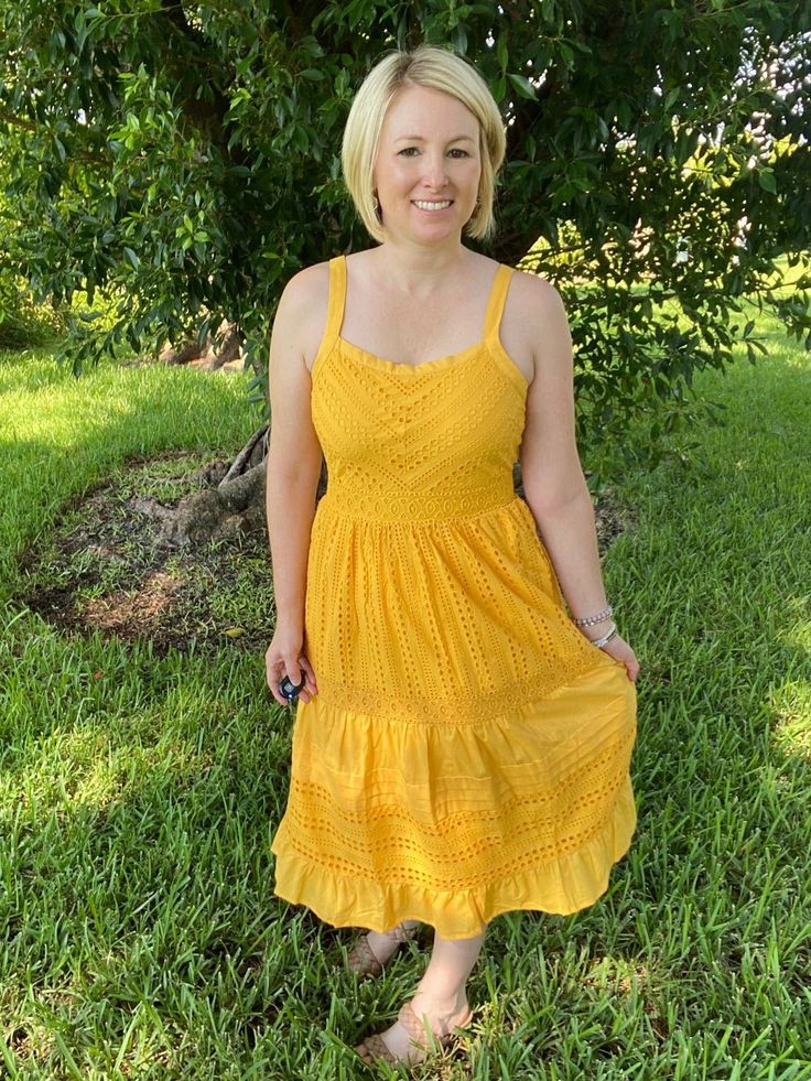 This yellow eyelet midi dress with pockets is the perfect amount of feminine, flirty, classy, and happy this summer! With a cinched waist, eyelet pattern, zipper back, and ruffle bottom, this dress will take you from day to night in ease! Pair with a clutch and espadrilles and you're summer ready! Brand: Skies are BlueDescription: Yellow eyelet sleeveless midi dress; back zipper; pockets; cinched waist; linedFit Info: True to Size, Whitney wears a SmallLength: The length hits mid calfBust: The b