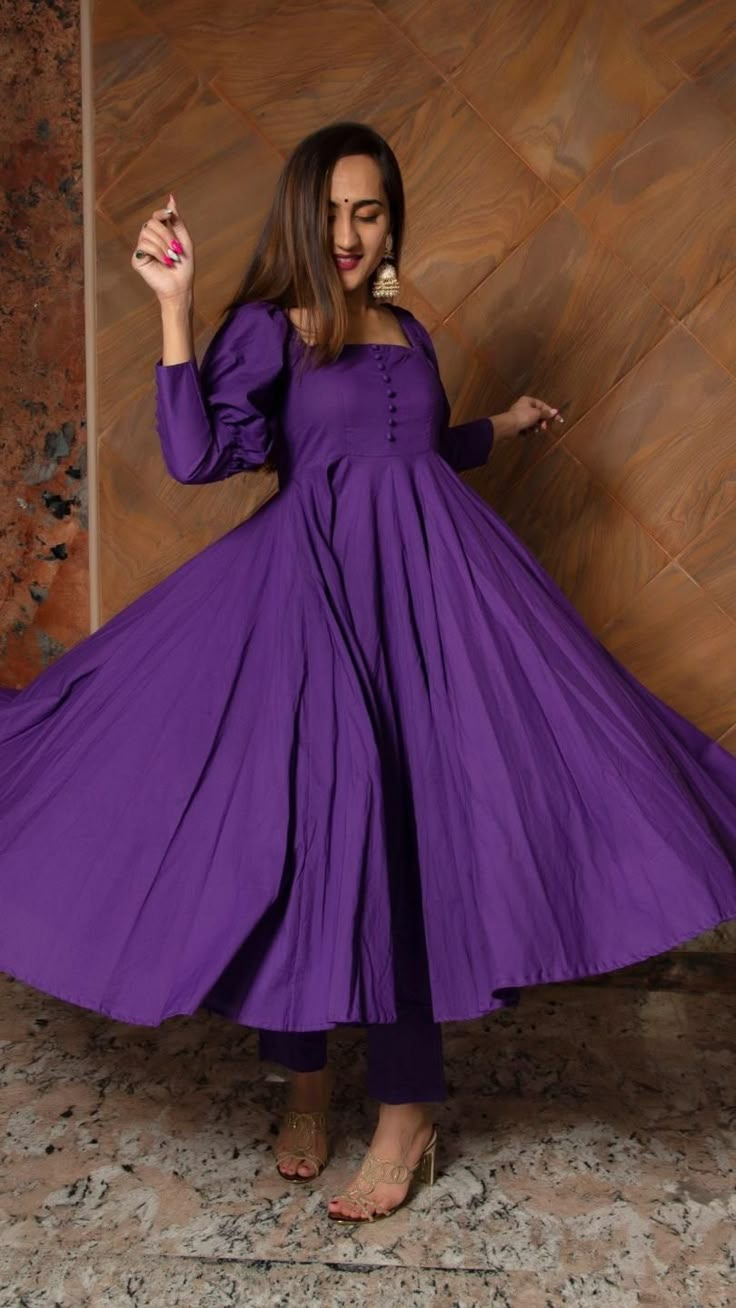 PRODUCT DESCRIPTION: Anarkali : Cotton Pant: Cotton Dupatta: Oragnza Color: PURPLE No. Of Components : Set of 3 Wash Care : EASY WASH Work: Gotta lace work Customization : Only Size and Length Of Product SKU#: 11403122PR Disclaimer: All our pieces are handcrafted in our manufacturing unit .We Ensure that our pieces are shot professionally under controlled lighting. Colours tend to be perceived differently depending on factors such as shot angles, lighting, background tones and colour temperature Purple Kurta Woman, Red Anarkali Suits, Purple Anarkali, Cotton Anarkali, Tiered Dresses, Anarkali Dress Pattern, Frock For Women, Patiala Suit, Kurti Designs Latest