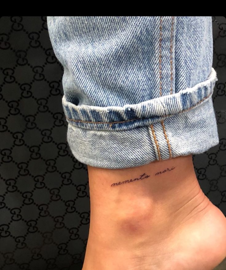 a woman's foot with a small tattoo on the ankle that reads, i love you