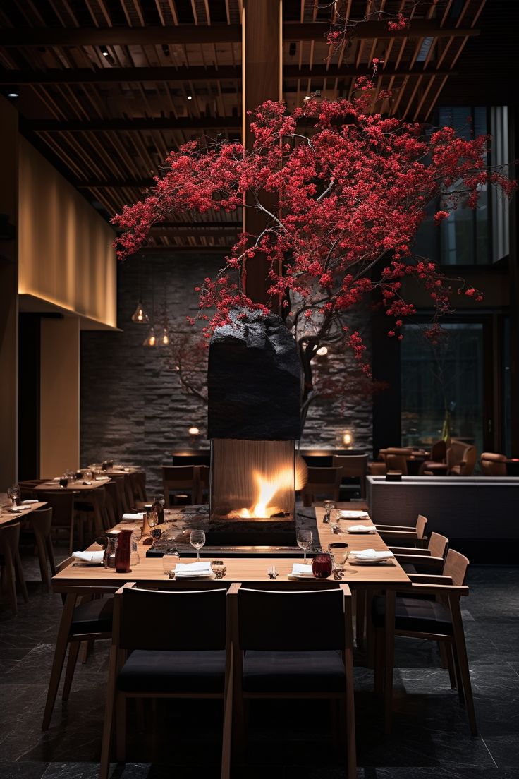 a dining room with tables and chairs is lit up by the light from an open fire place