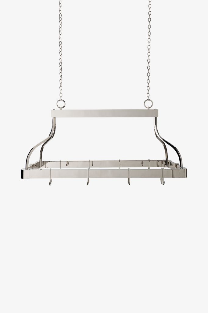 a long metal shelf with hooks hanging from it