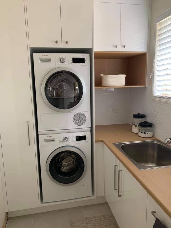 a washer and dryer in a small kitchen