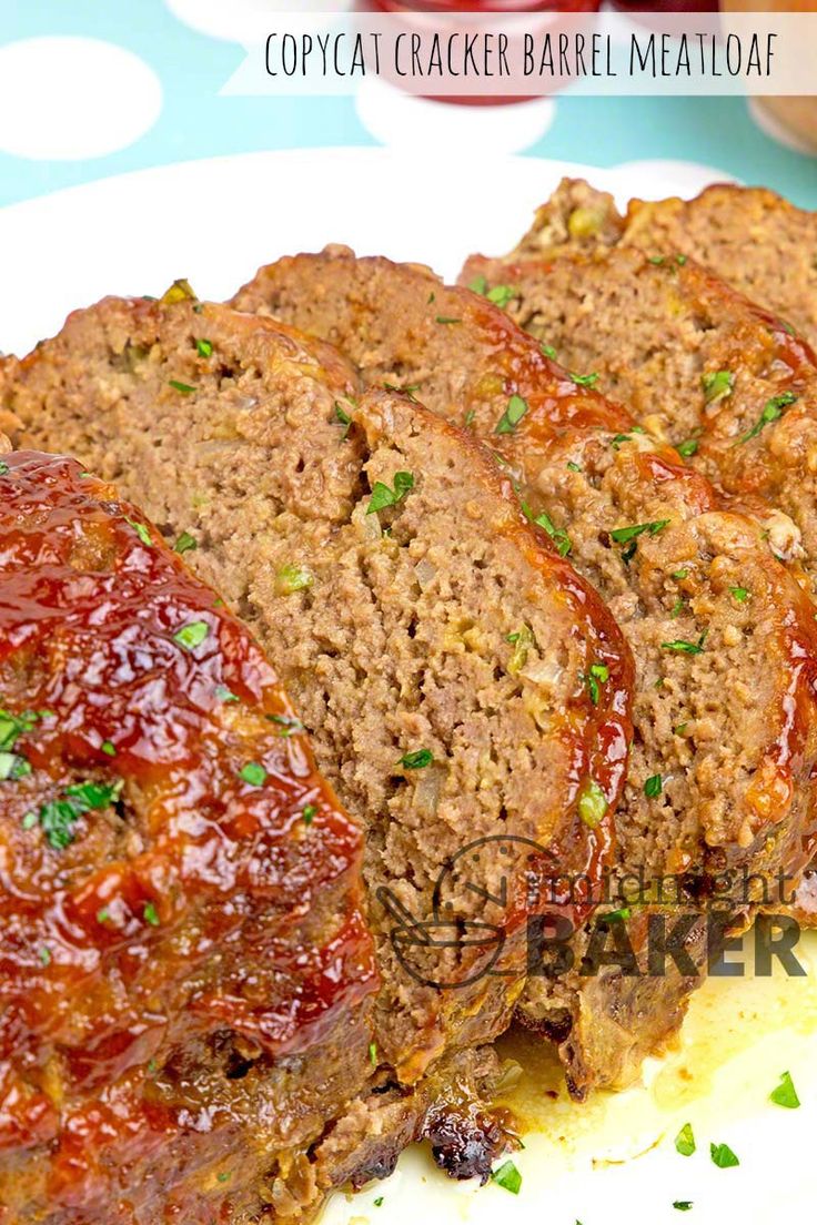 sliced meatloaf on a plate with sauce and parsley