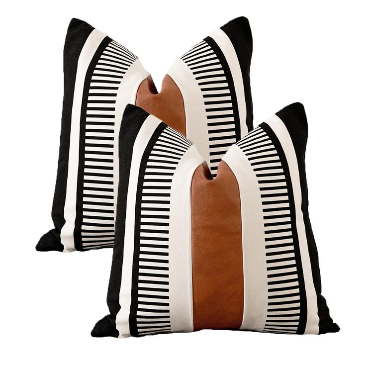 two black and white striped pillows with brown trims on each pillow, one in the middle