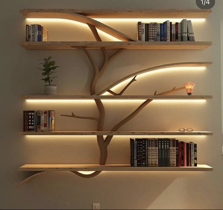 a book shelf with several books on it and some lights around the tree branch that is lit up