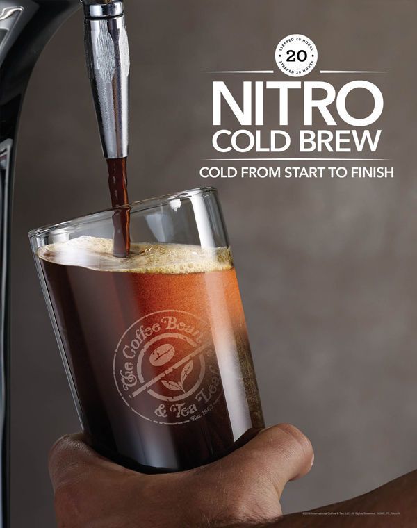 a hand holding a glass filled with liquid next to an espresso machine and the words nitro cold brew