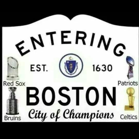 the sign for boston city of champions is white with black lettering and images of trophies