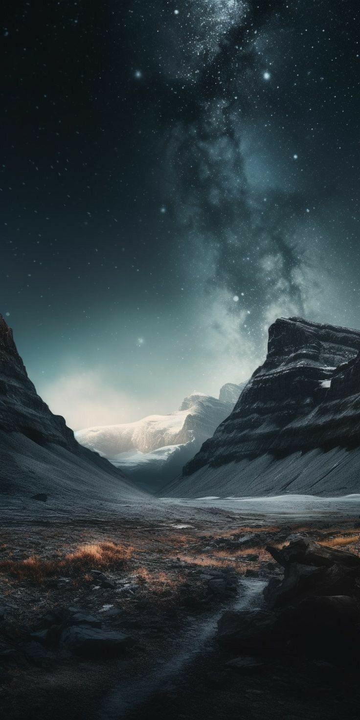 the night sky is filled with stars and clouds, as seen from an empty valley