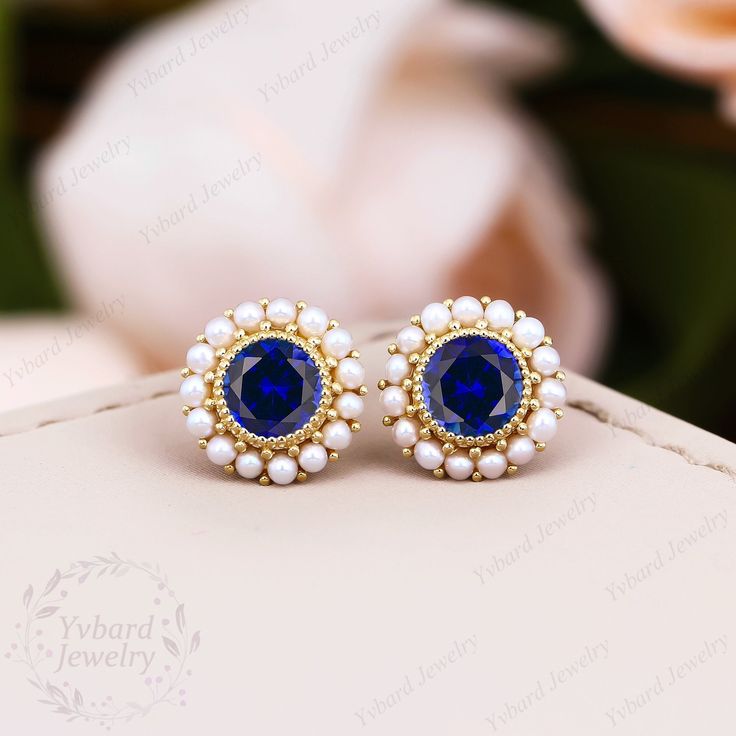 "❤Jewelry Details -Gold Type : Solid 10K Gold / Solid 14K Gold / Solid 18K Gold / Platinum (Choose One in Material Option) -Center Stone: Lab Created Sapphire 5.0mm, Approximately 0.5ct*2pcs Cut: Round Cut / 3EX -Side Stone: Natural Pearl Earring outer diameter: 9.0mm SKU: YE0061 ~*-*~Purchase Guarantee: - All our jewelry is handmade, and each process is refined. - 14 Day Refund Guarantee. - All our products are Free Shipping. - Free Gift Box&Packing. ~*-*~Please contact us if you need service: 1. Ring Resizing. 2. Metal Change(PT950/10k/14k/18k White/Yellow/Rose Gold). 3. Engraving ring (less than 10 letter). 4. Accept customization. We believe that our quality, attention to detail, design and customer service make us stand out from the competition. If you have any questions, please let m Blue Pearl Earrings For Anniversary Fine Jewelry, Blue Pearl Earrings For Anniversary, Blue Round Bridal Earrings For Formal Occasions, Blue Fine Jewelry Earrings For Wedding, Gold Sapphire Earrings For Wedding, Blue Round Pearl Earrings For Anniversary, Royal Blue Round Jewelry For Anniversary, Sapphire Jewelry With Matching Earrings For Wedding, Blue Round Pearl Earrings For Wedding