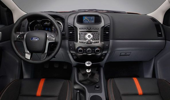 the interior of a car with black and orange trims