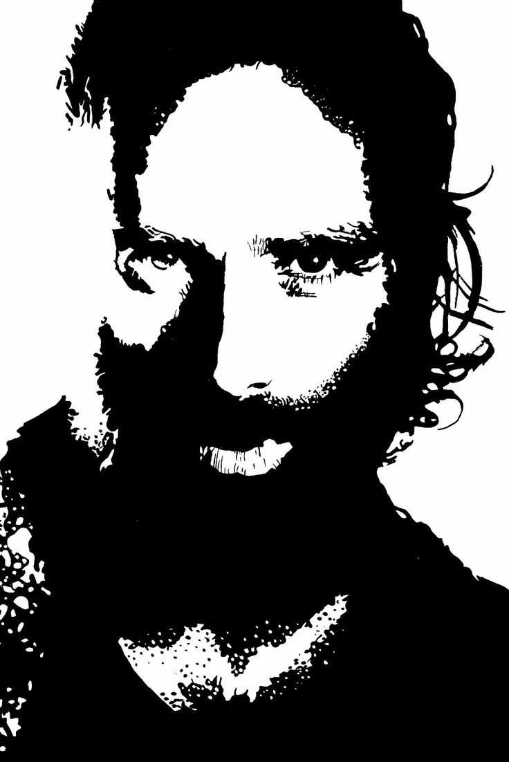 a black and white photo of a man with long hair, beard and mustaches