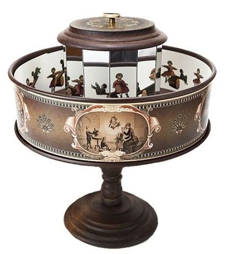 an ornately decorated cake stand with pictures on it