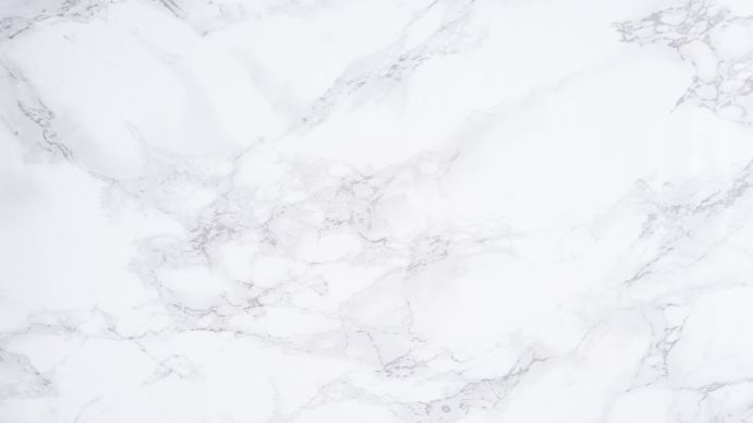 a white marble counter top with grey veining