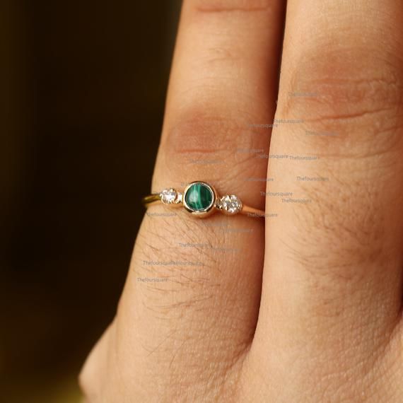 14K Gold Malachite Ring, Diamond Ring, Dainty Wedding Ring, Gemstone Engagement Ring, Band Ring For Her, Sun Design Ring, Stackable RingProduct info:14k solid goldnatural diamond - white diamondwhite diamonds, I color, SI claritywhite diamonds -  1.2 mm, I, SI clarityMalachite: 0.14 ct, AA+Ring Size 7Item will be resized and shipped within 10 days.ITEM Will BE SHIPPED : India Speed PostTo get the item in 4-5 days, we can also ship it thru DHL express, please contact us before.Please select your Dainty 14k Gold Three-stone Jewelry, 14k Gold Emerald Ring For Wedding, May Birthstone, Delicate 14k Gold Three-stone Jewelry, Delicate Three Stone 14k Gold Jewelry, Green Bezel Setting Stackable Rings For Wedding, Green Three Stone Birthstone Ring In 14k Gold, Wedding Rings In 14k Gold With May Birthstone, Dainty Emerald Rings For Promise, Dainty Round Emerald Promise Ring