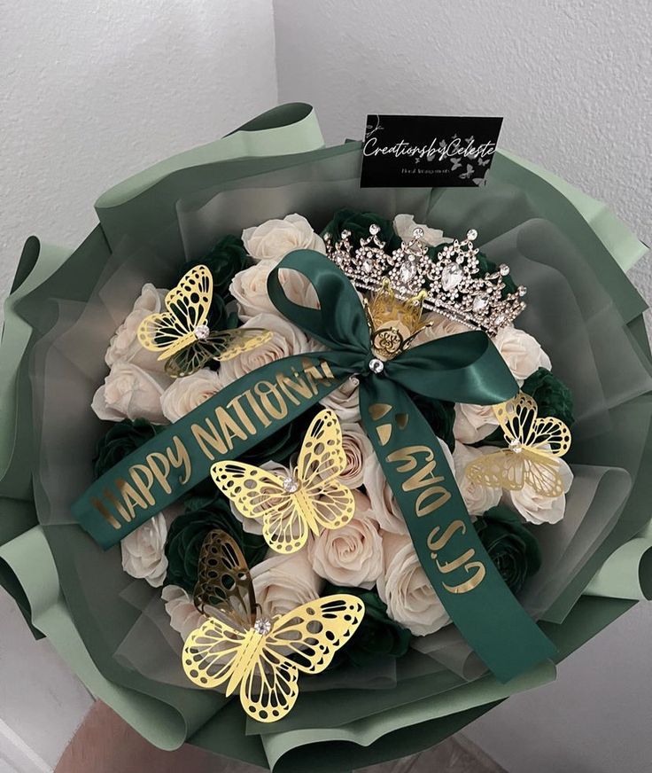 a bouquet of flowers with butterflies on it and a happy national day sign in the middle