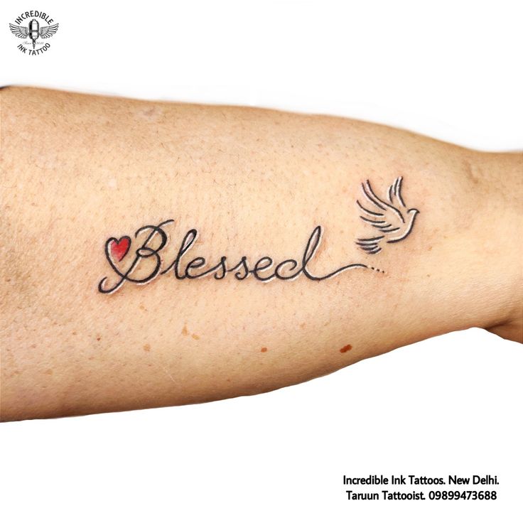 a woman's arm with a tattoo that says, i love jesus and dove