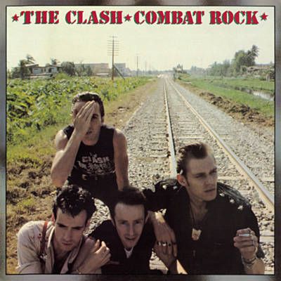 the clash - combat rock album cover with three men standing on railroad tracks and one man covering his eyes