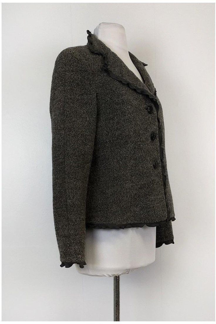 Keep warm while looking stylish in this chic jacket. Made with a ruffle trim, you can pair it with a fitted top and skinny jeans. Add a pair of tall boots and you will be ready to hit the town in style. Size 8 (IT 44) 84% wool, 10% polyamide, 6% alpaca Made in Italy Button down front Ruffle trim Long sleeve Bust 38" Waist 35" Shoulder to hem 23" Chic Jacket, Jaco, Armani Collezioni, Fitted Top, Casual Style Outfits, Tall Boots, Wool Jacket, Ruffle Trim, Keep Warm