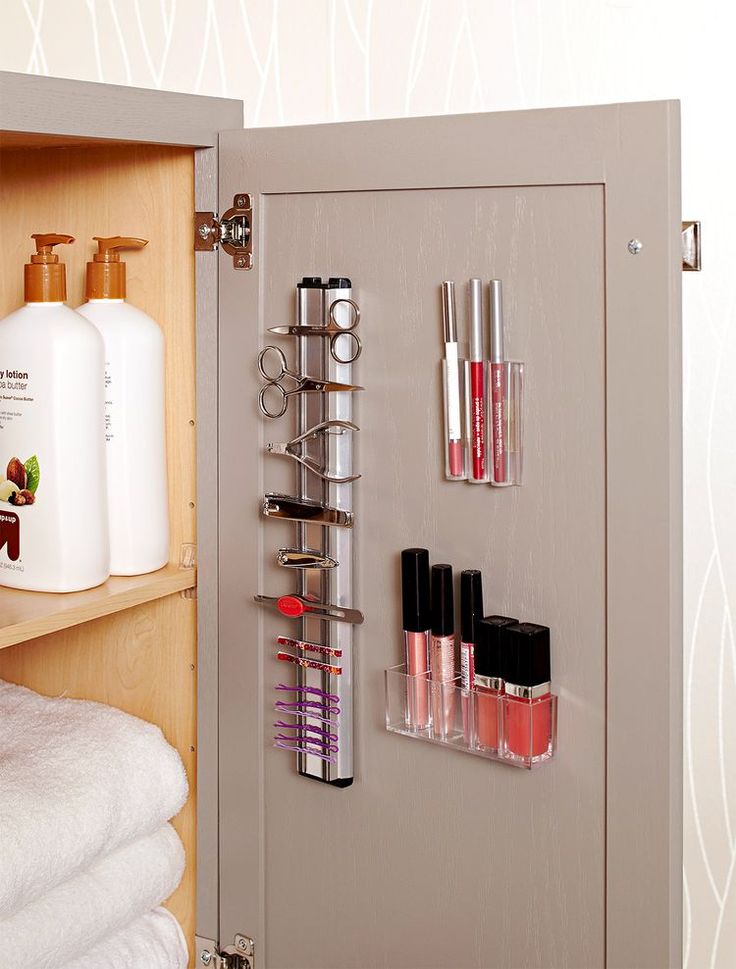 an open cabinet with cosmetics and toiletries on it