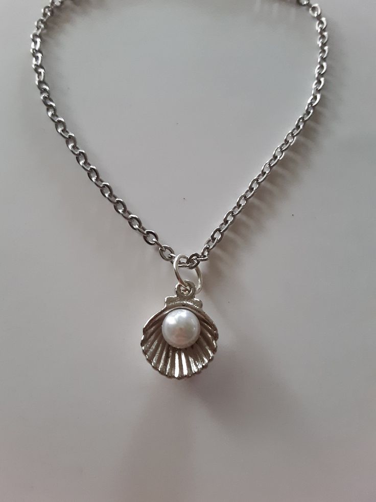 dainty white pearl in silver shell necklace, pretty delicate gift or keep for yourself Silver Charm Necklace With Pearl Charm As A Gift, Silver Pearl Shell Necklace Gift, Silver Shell-shaped Necklace With Pearl Pendant, Silver Pearl Shell Necklace As A Gift, Dainty Metal Pearl Necklace For Gift, White Dainty Pearl Necklace With Metal, Silver Pearl Shell Necklace For Gift, Silver Pearl Necklace With Silver Chain As Gift, Elegant Silver Charm Necklace With Pearl Pendant