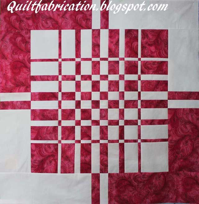 a red and white quilt with squares on it