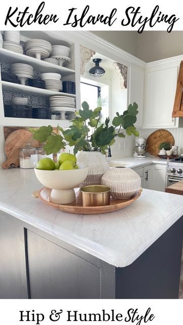 a kitchen island with plates and bowls on it in front of the counter top that says, kitchen island styling hip & humble style