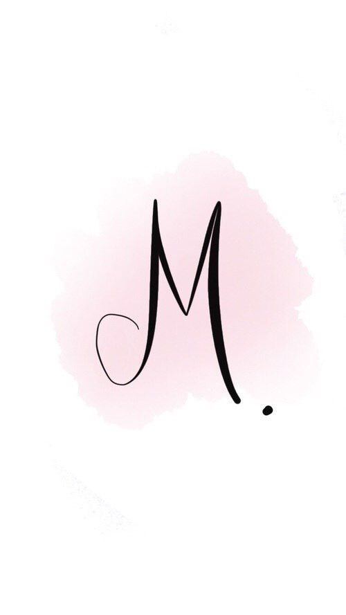 the letter m is written in black ink on a pink background with watercolor stains