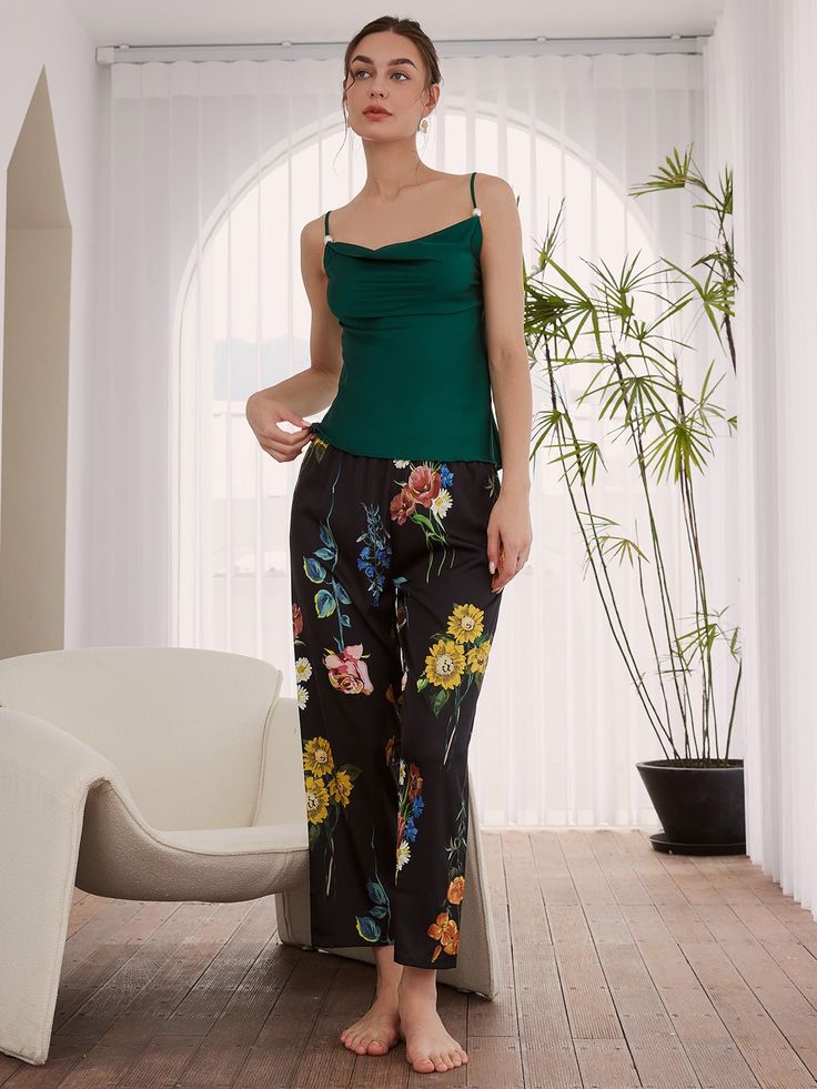 A vintage floral printed pajama set with kimono robe.3pcs: a long robe, a camisole and a long pants.- Black fabric with colorful flowers, contrast green cami and tassel cuffs.- Polyester Charmeuse, silky comfort, machine wash cold.- Removable waist tie closure.- Elastic waistband.- Lapel neckline. - Pearl detailing on straps.- Relaxed fit with a luxurious flowing drape. Spring Nightwear Sets Fitted, Chic Silk Loungewear Sets, Fitted Night Sets For Spring, Elegant Fitted Sets For Night, Elegant Fitted Night Sets, Elegant Night Sets, Elegant Spring Camisole Sleepwear, Spring Sleeveless Night Sets, Sleeveless Night Sets For Spring