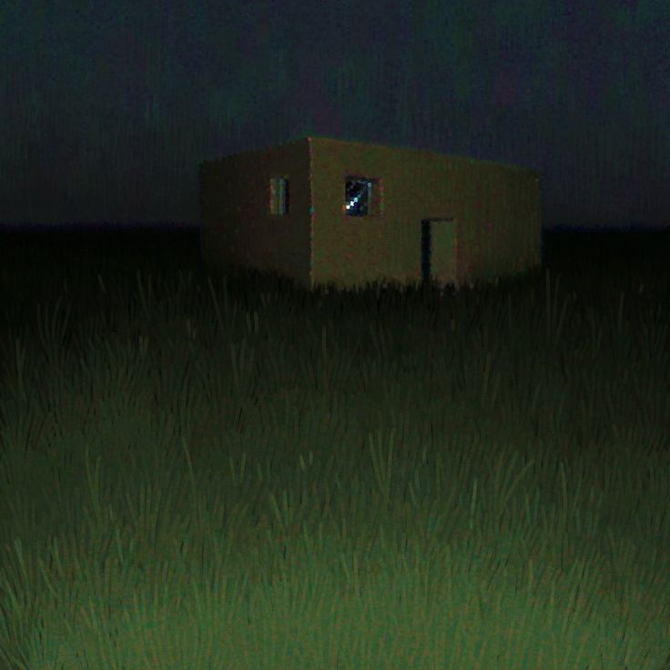 a small building sitting in the middle of a grassy field at night with lights on