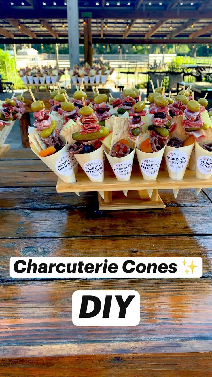 a wooden table topped with lots of different types of food on top of each other