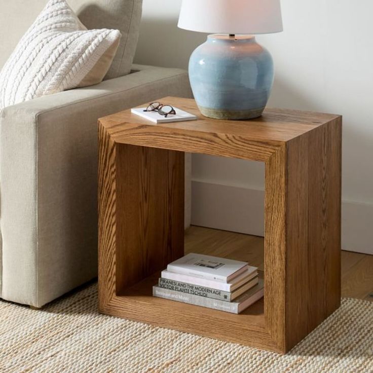 a table with a lamp on it next to a couch