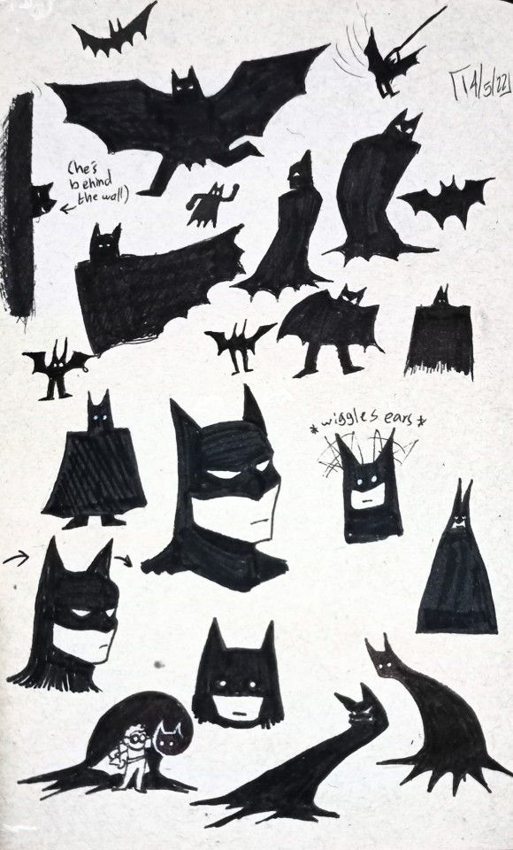 some black and white drawings of batman's heads, bats, and cats in various poses