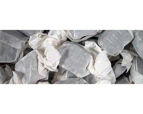 a pile of gray and white pieces of paper