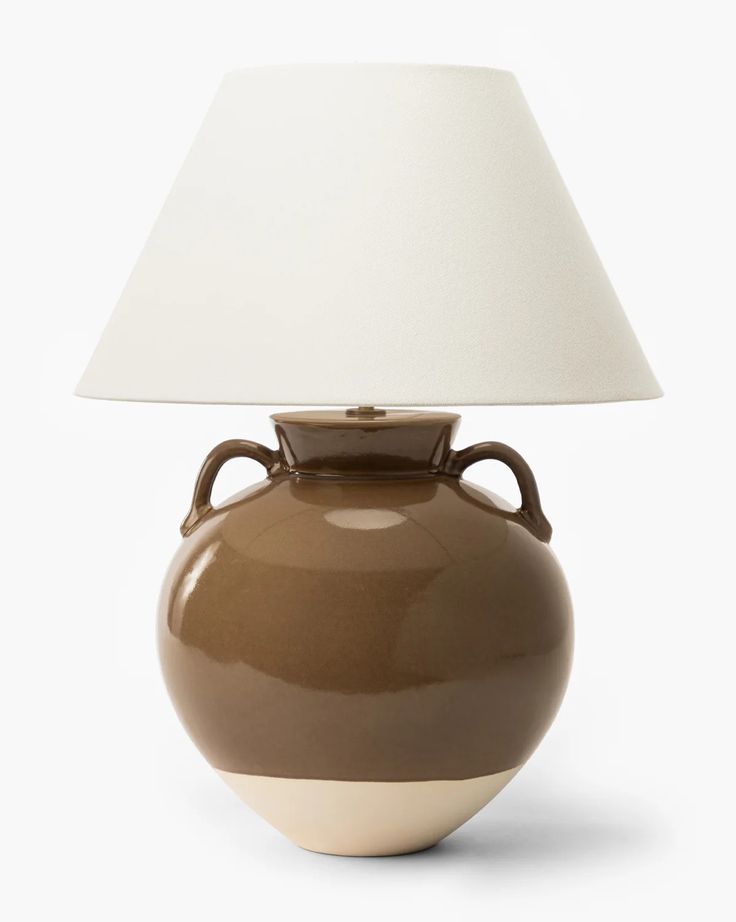 a brown vase with a white shade on it