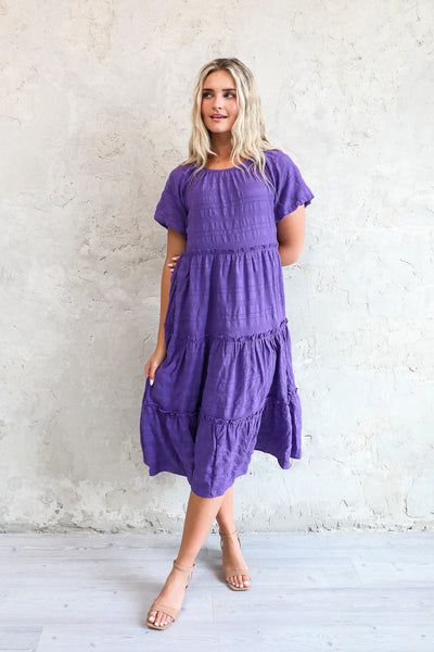 Flowy Tiered Midi Dress Casual, Flowy Tiered Casual Midi Dress, Flowy Tiered Midi Dress Casual Style, Casual Solid Color Short Sleeve Tiered Dress, Casual Tiered Ruffle Midi Dress, Casual Tiered Dress With Short Sleeves, Casual Midi Length Tiered Ruffle Dress, Casual Tiered Midi Dress With Ruffles, Casual Midi Length Tiered Dress With Ruffle Hem