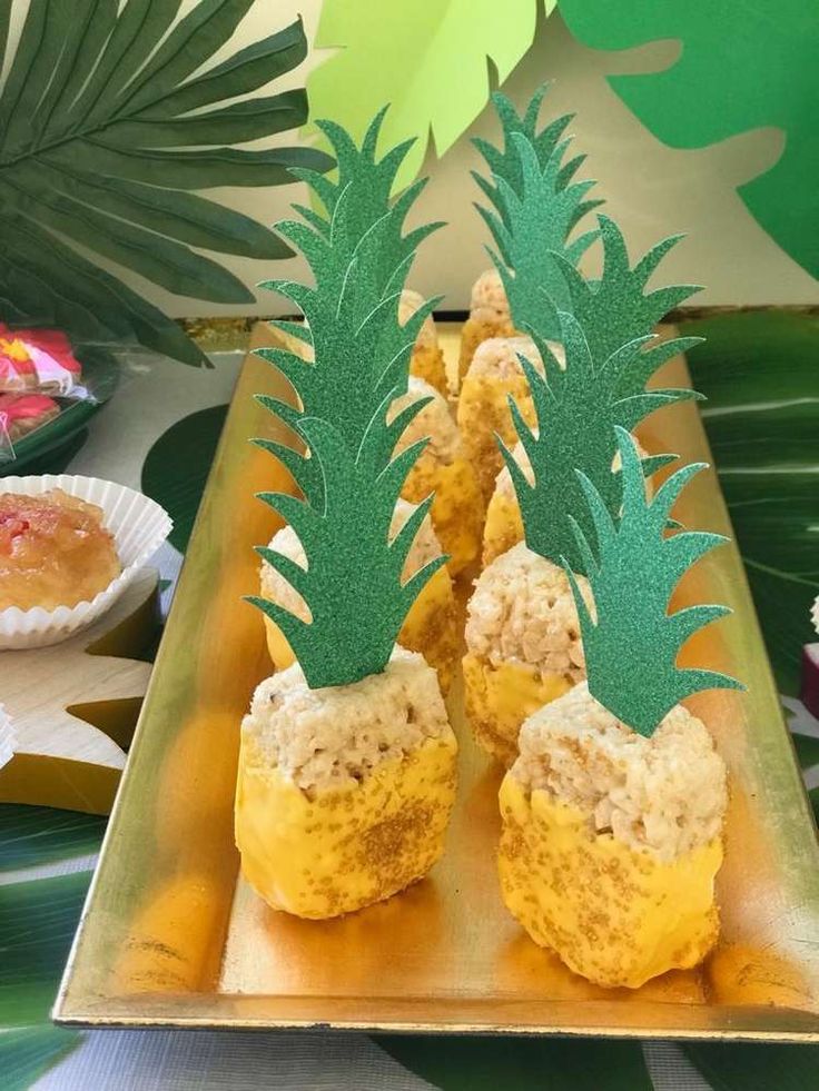 there are pineapples with rice in them on a tray