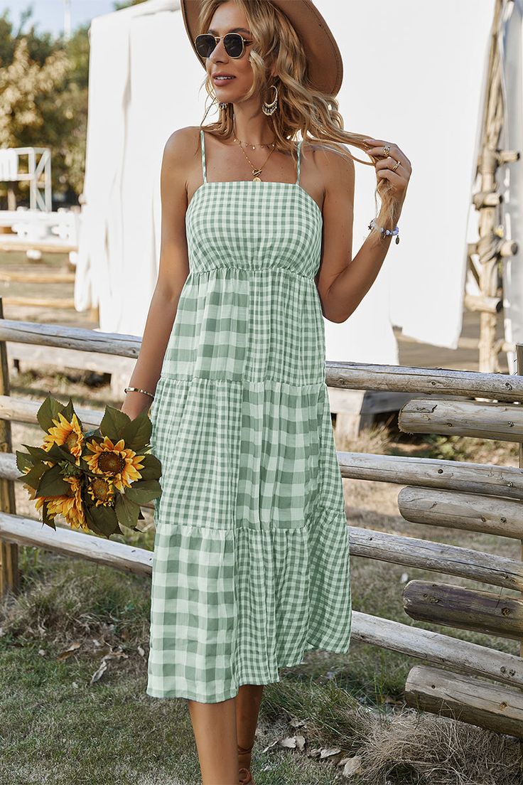 Our Margaretta Dress comes in a pistachio and mint checkered print. This features a singlet style, sleeveless with frill details, an elastic bodice, and a flowy skirt. The relaxed fit mid pairs beautifully with our heels or sandals for a fun casual look! Size Guide: Esmée is 5’7” tall, and has a 34.5” bust, 26.22” waist, & 34.6” hips. She is wearing a S / US 4 / AU 8. This dress is true to size. Material: 50% Viscose, 50% Polyester. Feature: Midi length. Elastic shirred bodice. Sleeveless with f Plaid Summer Dress, Boho Plaid, Plaid Dress Vintage, Sundress Casual, Backless Midi Dress, Sling Dress, Gingham Dress, Polyester Dress, Boho Casual