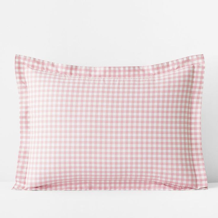 the pink gingham pillow case is shown