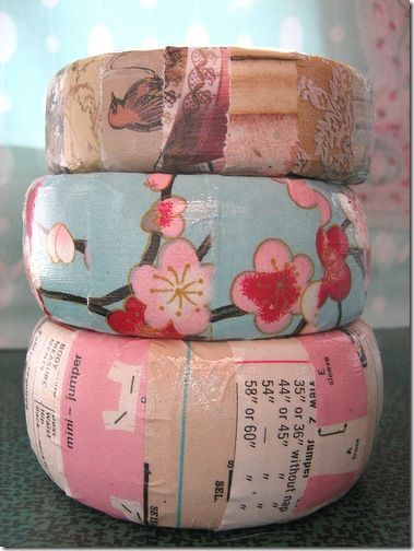 three rolls of japanese washi paper stacked on top of each other in different colors