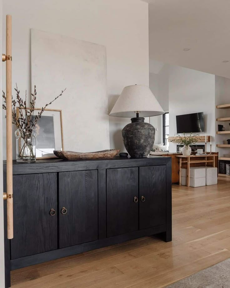 a living room filled with furniture and a lamp