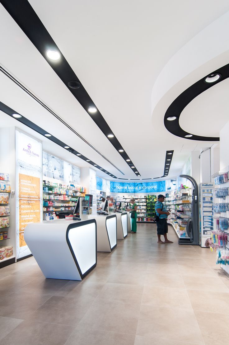 the interior of a grocery store with people shopping in the aisles and on the shelves