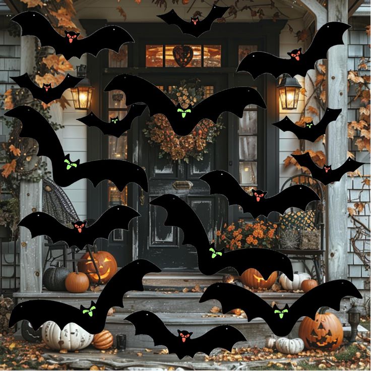 a bunch of bats that are on the front steps of a house with pumpkins