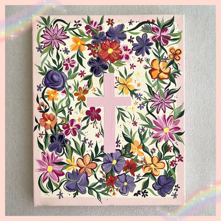 a cross surrounded by colorful flowers on a white background with a pink border around it