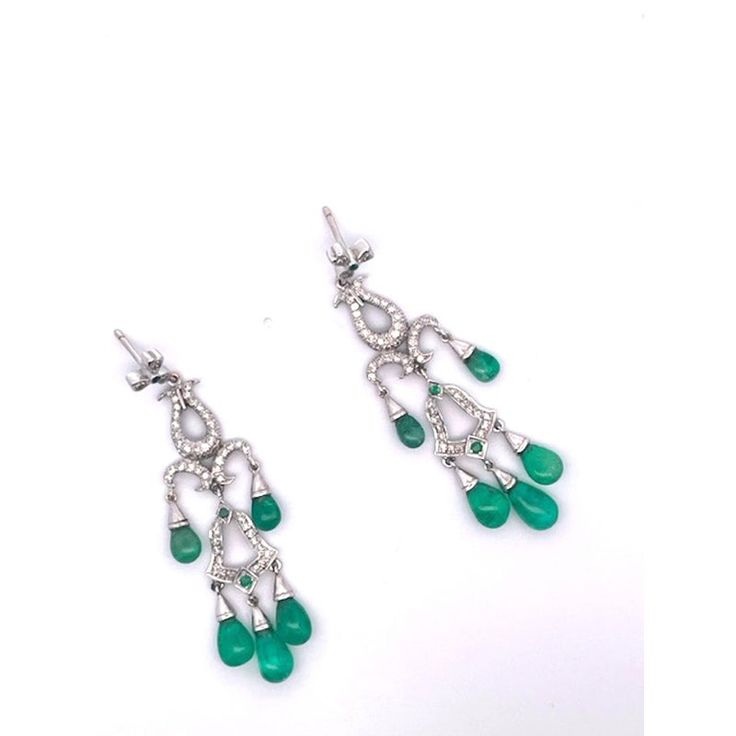 This is part of Chairish’s Fine Jewelry assortment.  These gorgeous Chandelier Earrings are just beautiful.  They are made in 14K white Gold and set with five (5) Emerald Cabochon drops, three (3) small Emeralds are studded within the Diamonds. The length is 5.5 cm or 2 1/2" long.  These earrings pack a punch as they are just stunning.  There are probably approximately 2 carats of Diamonds  throughout.  These earrings are lovely by themselves but I also have a gorgeous pendant that works perfect Fine Jewelry Chandelier Earrings With 17 Jewels, Fine Jewelry Chandelier Drop Earrings, Classic Chandelier Dangle Earrings With 17 Jewels, Elegant Hand-set Pear-shaped Earrings, Elegant Hand Set Pear-shaped Earrings, Elegant Sterling Silver Hand Set Chandelier Earrings, Elegant Gemstone Dangle Chandelier Earrings, Elegant Briolette Gemstone Chandelier Earrings, Exquisite Sterling Silver Dangle Chandelier Earrings