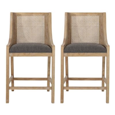 This 2-piece set of bar stools completes your breakfast nook or home bar with a mix of classic coastal materials. Each is crafted from solid and engineered wood in a light natural beige. The rectangular silhouette features a square base with a built-in footrest and wing-back-inspired seat. The back and sides have cane wicker panels for a breezy look and feel. Plus, these bar stools both come with cushions wrapped in polyester in a neutral hue. We love that they come with plastic glides on the fe Bar Space, Cane Webbing, Rustic Fabric, Indoor Bar, Leather Counter Stools, Kitchen Nook, Wood Counter, Counter Height Bar Stools, Beachcrest Home