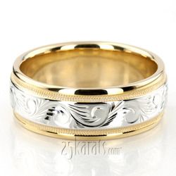 two tone gold and silver wedding band with floral engraving on the side, set against a white background