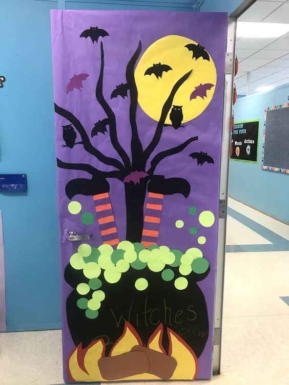 a purple door decorated with halloween decorations and bats