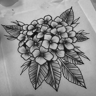 a black and white drawing of flowers on paper