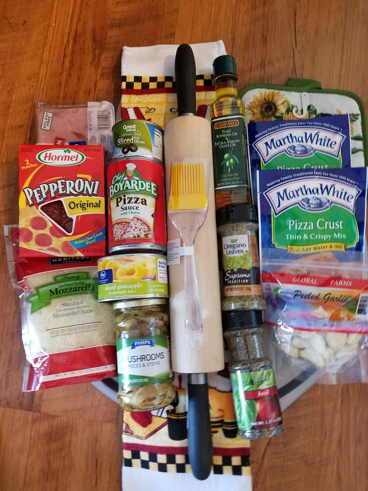 an assortment of food items sitting on top of a wooden table